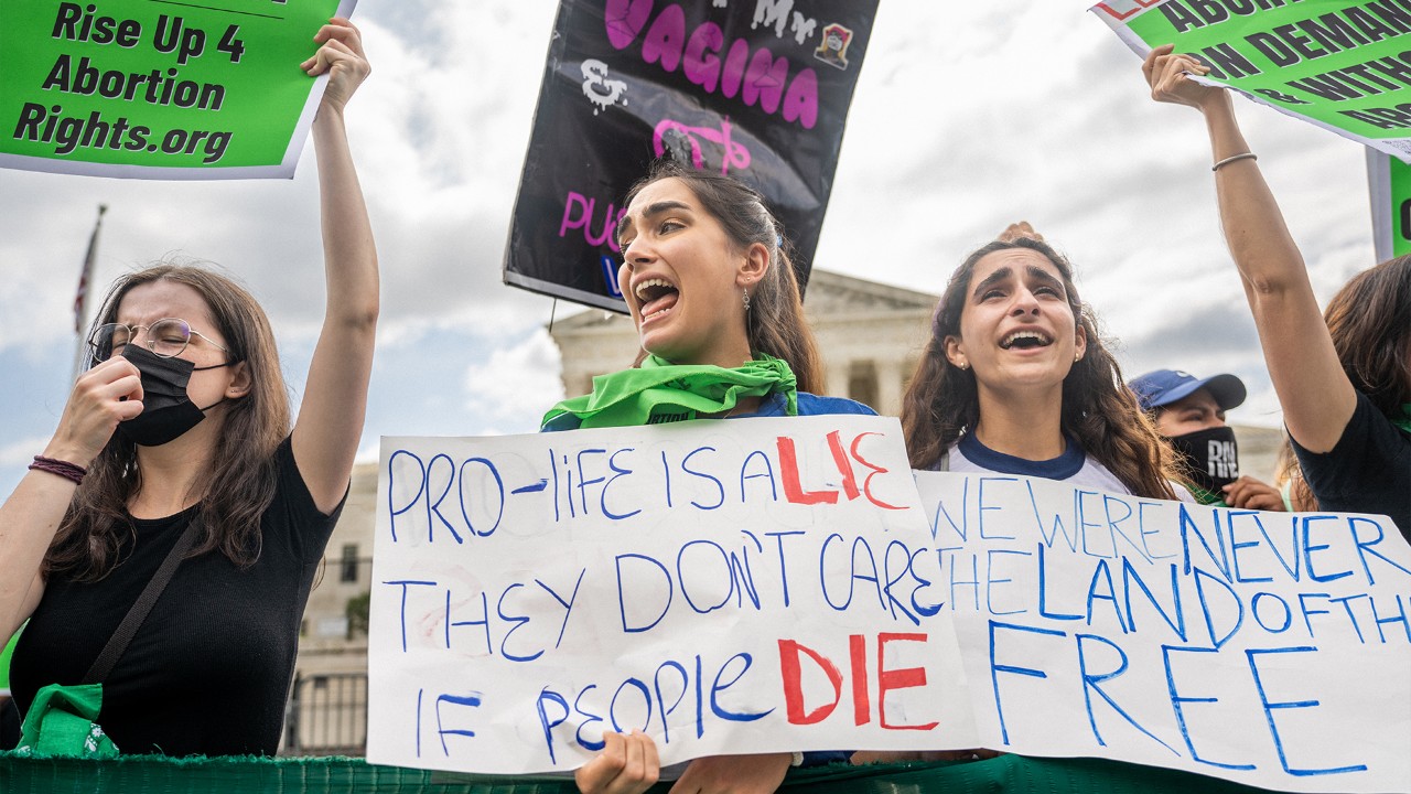 Abortion rights activists react to the Dobbs v Jackson Women's Health Organization ruling in front of the U.S. Supreme Court.